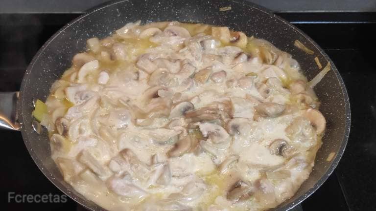 onion and mushrooms in the pan